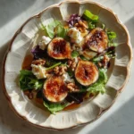 Exquisite Caramelized Fig and Goat Cheese Salad with hot honey and walnuts.