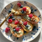 Delicious Baked Pears with Blue Cheese, Berries, and Honey.