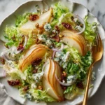 Delicious Crisp Autumn Pear Salad with blue cheese, pistachios, and zesty dressing.