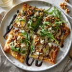 Separated ingredients for Pear Gorgonzola and Walnut Flatbread including flatbread, pear, Gorgonzola, and walnuts.
