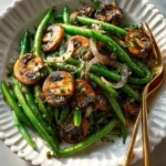 Deliciously Easy Green Beans with Mushrooms in a savory sauce.