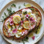 Delicious Floral Whipped Ricotta Toast with lemon curd and edible flowers.