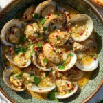 Delicious Coconut Broth Clams served in a fragrant white coconut milk broth with herbs.