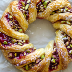 Delicious Raspberry & Pistachio Wreath with powdered sugar.