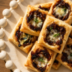 A tray of golden French Onion Bites with melted Gruyère cheese and caramelized onions.